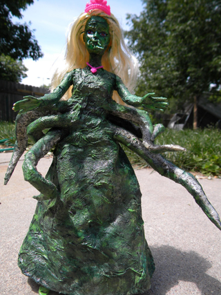 Illustration for article titled In her dream house at R'lyeh, dead Cthulhu Barbie waits dreaming
